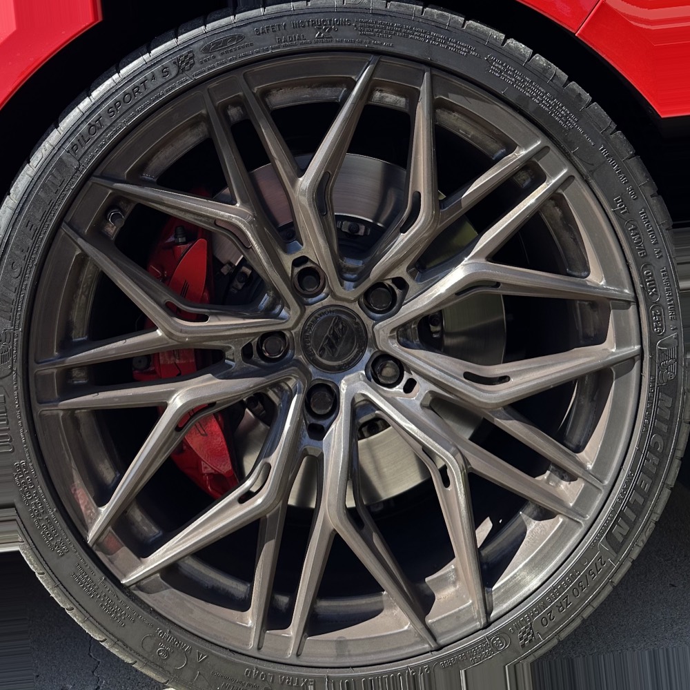 Before — alloy wheel coated in brake dust, finish dulled